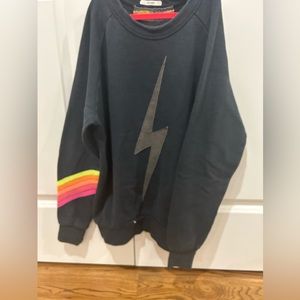 Charcoal gray Aviator Nation lightning bolt crewneck with neon stripes on sleeve
